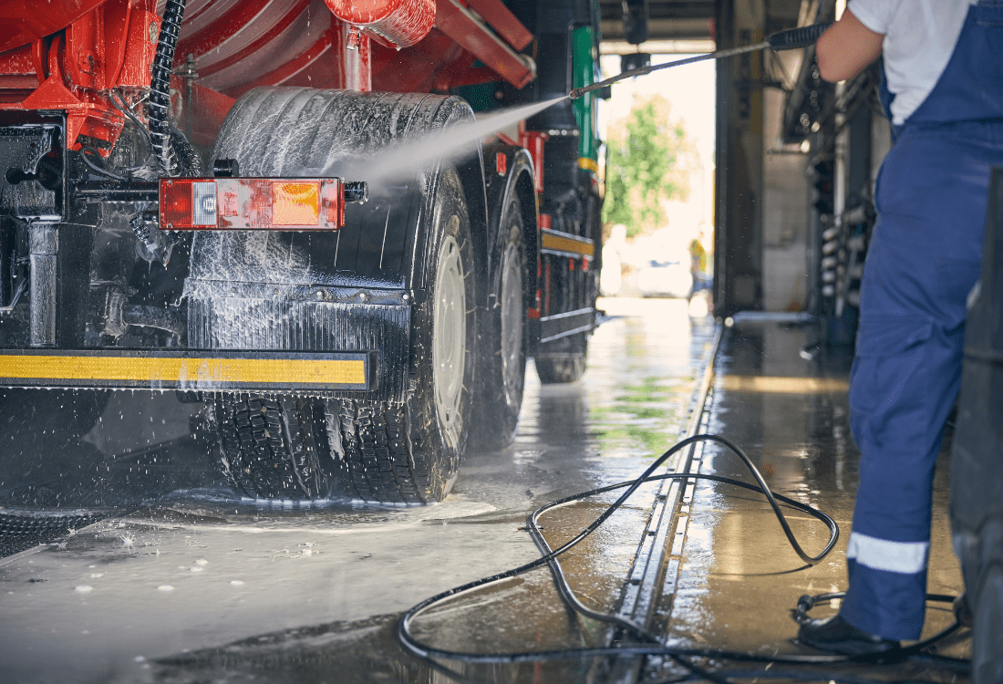 Woman washing truck using the water recycling system